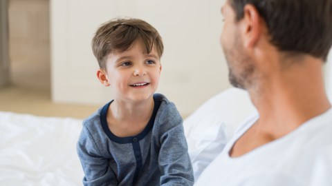 A young boy discussing his anxiety with his father