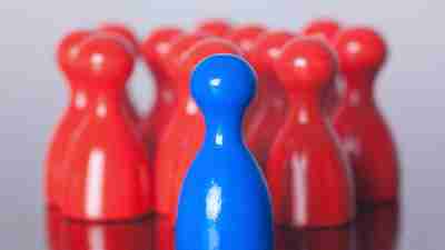 Blue and red game pieces grouped together, a metaphor for ADHD coping skills