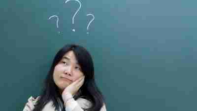ADHD Woman wit blackboard question marks