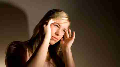 ADHD woman has a headache