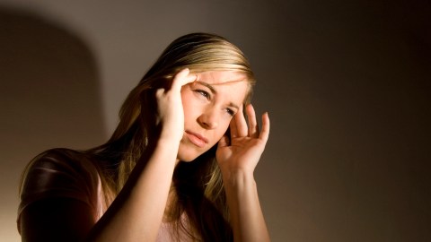 ADHD woman has a headache