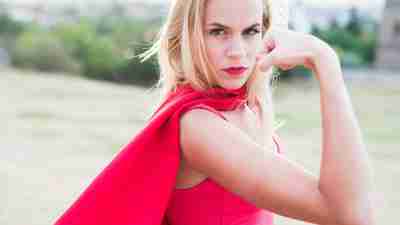 A woman posing as a superhero, a symbol for how celebrities with ADHD think of themselves