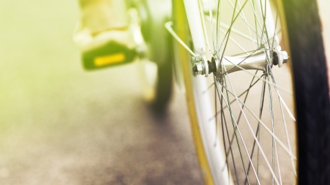 A person with ADHD rides a bicycle as part of a healthy lifestyle.