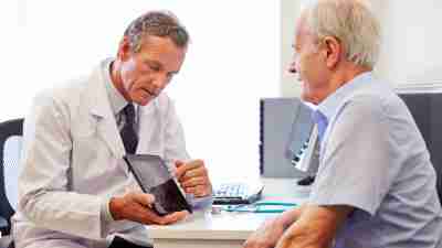 A psychiatrist explains the possible effects of an ADHD medication treatment plan to a patient.