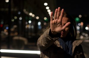 A woman with rejection sensitive dysphoria hiding her face with her hand